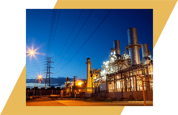 A large industrial plant with power lines in the background.