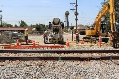 A group of people working on the tracks.