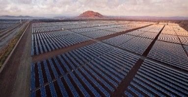 A large field of solar panels in the middle of nowhere.