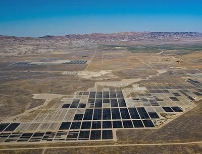 A large field of solar panels in the middle of nowhere.